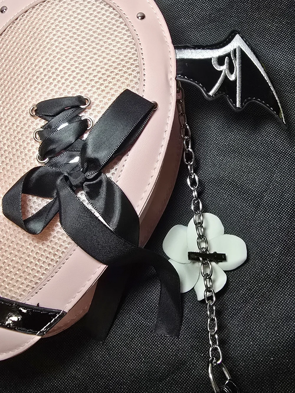 Heart-Shaped Pink Crossbody Bag with Gothic Ribbon Detail
